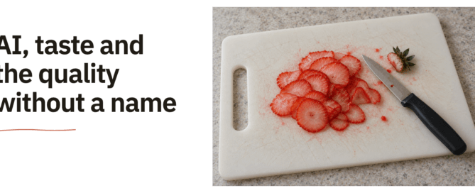 AI, taste and the quality without a name. Paper-thin strawberry slices and a small kitchen knife with a black handle rest on a used white plastic chopping board.